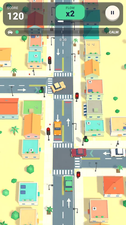 A sandy beach town with palm trees and cars at a signalled junction.
