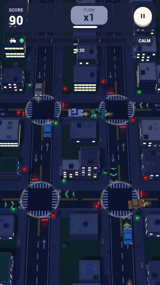 A dark city at night with four lit roundabout junctions.